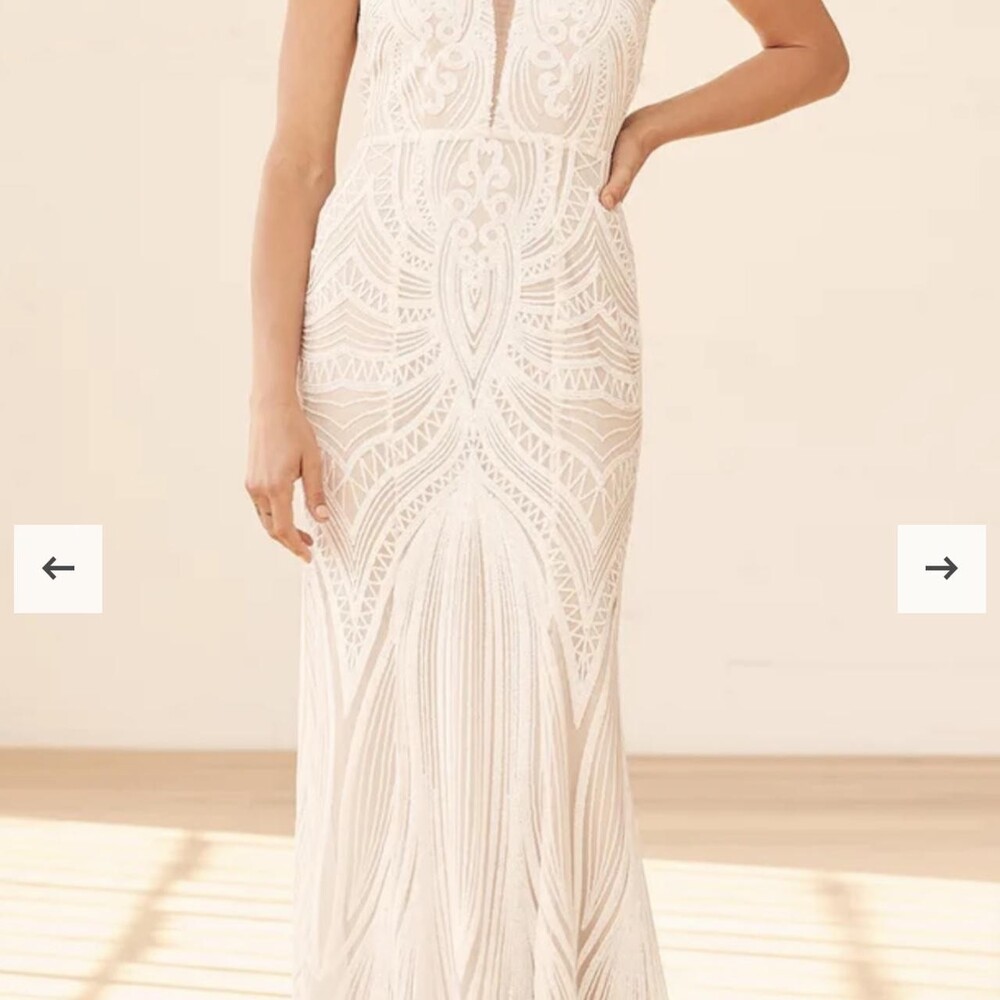 Cool-toned beige stretch knit and a white mesh overlay is dazzled up by shimmeri